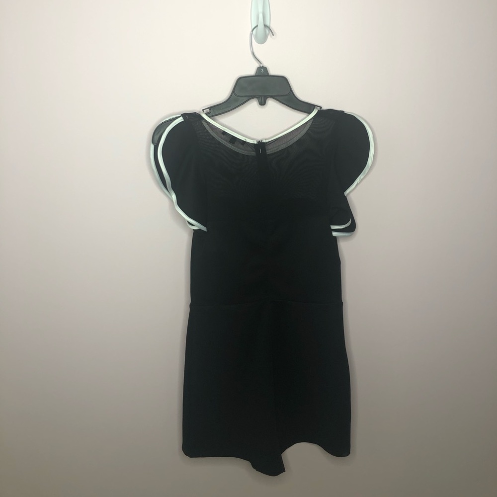 ENTRY Black Romper. Spit sleeve. White trim.